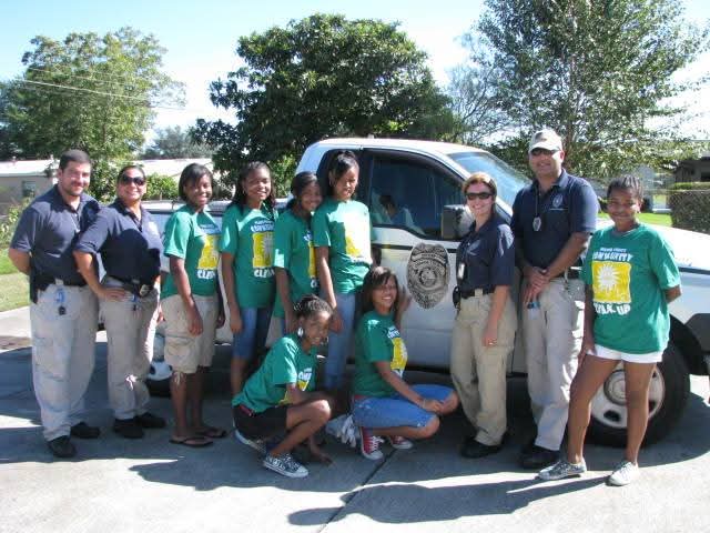 Marthaly with Orange County youth and code enforcement team at a neighborhood clean-up