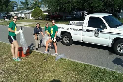 Marthaly volunteering at an Orange County community clean-up event