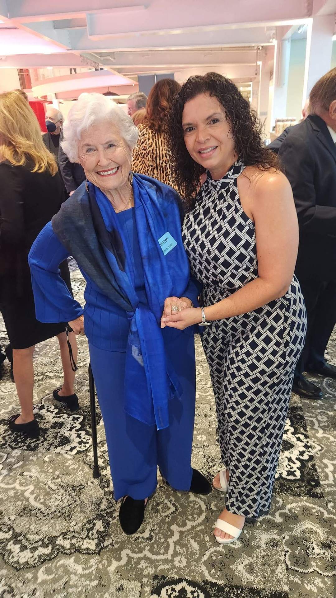 Marthaly with a community elder at a civic gathering