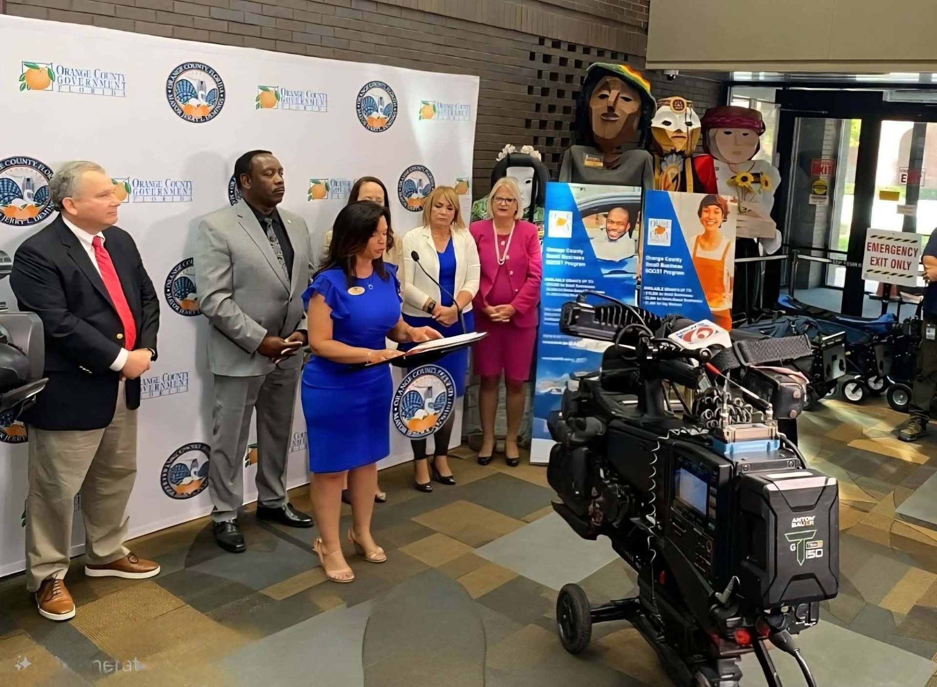 Marthaly speaking at an Orange County Government press conference