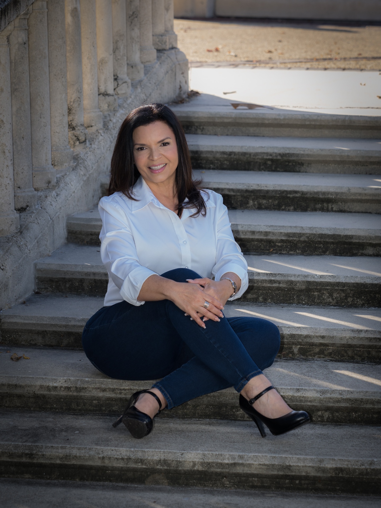 Marthaly on the steps of a community landmark